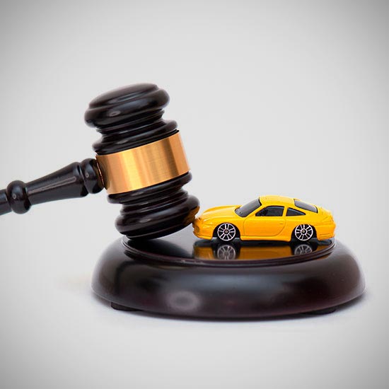 California’s CARS Act Makes First Communication Compliance Critical; A judge's gavel rests on its block beside a small yellow toy car, symbolizing legal matters related to automobiles. The image conveys authority and justice.